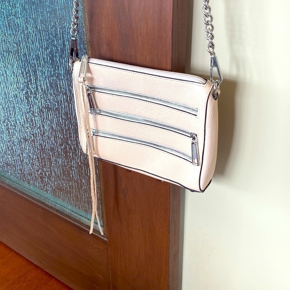 Rebecca Minkoff crossbody bag in a pale pink. Great summer bag! Zipper detail!